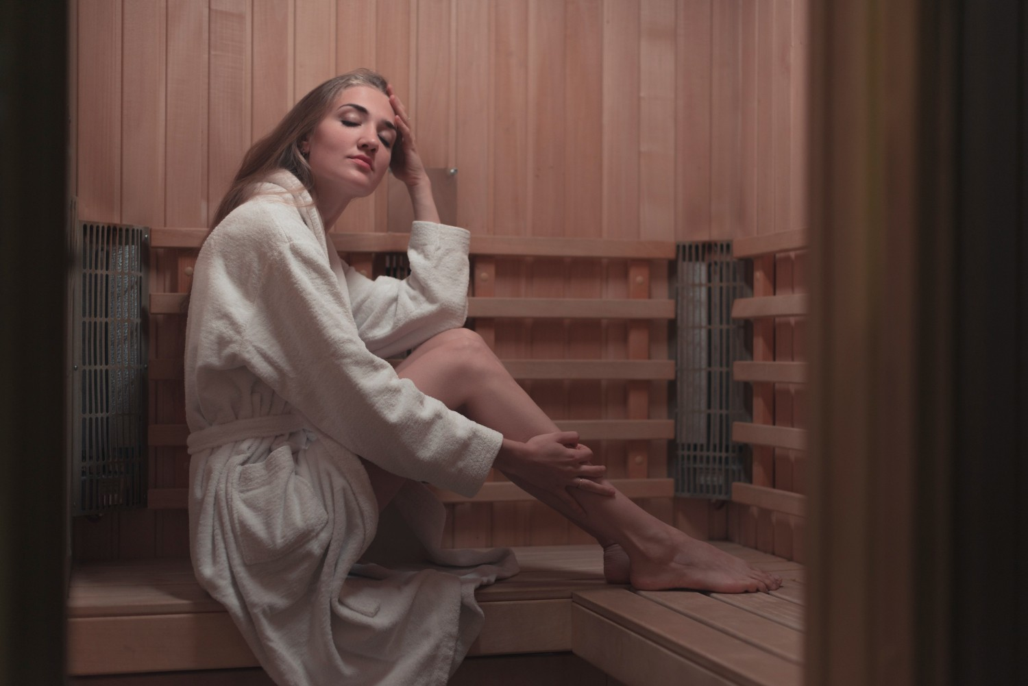 Woman relaxing in infrared sauna